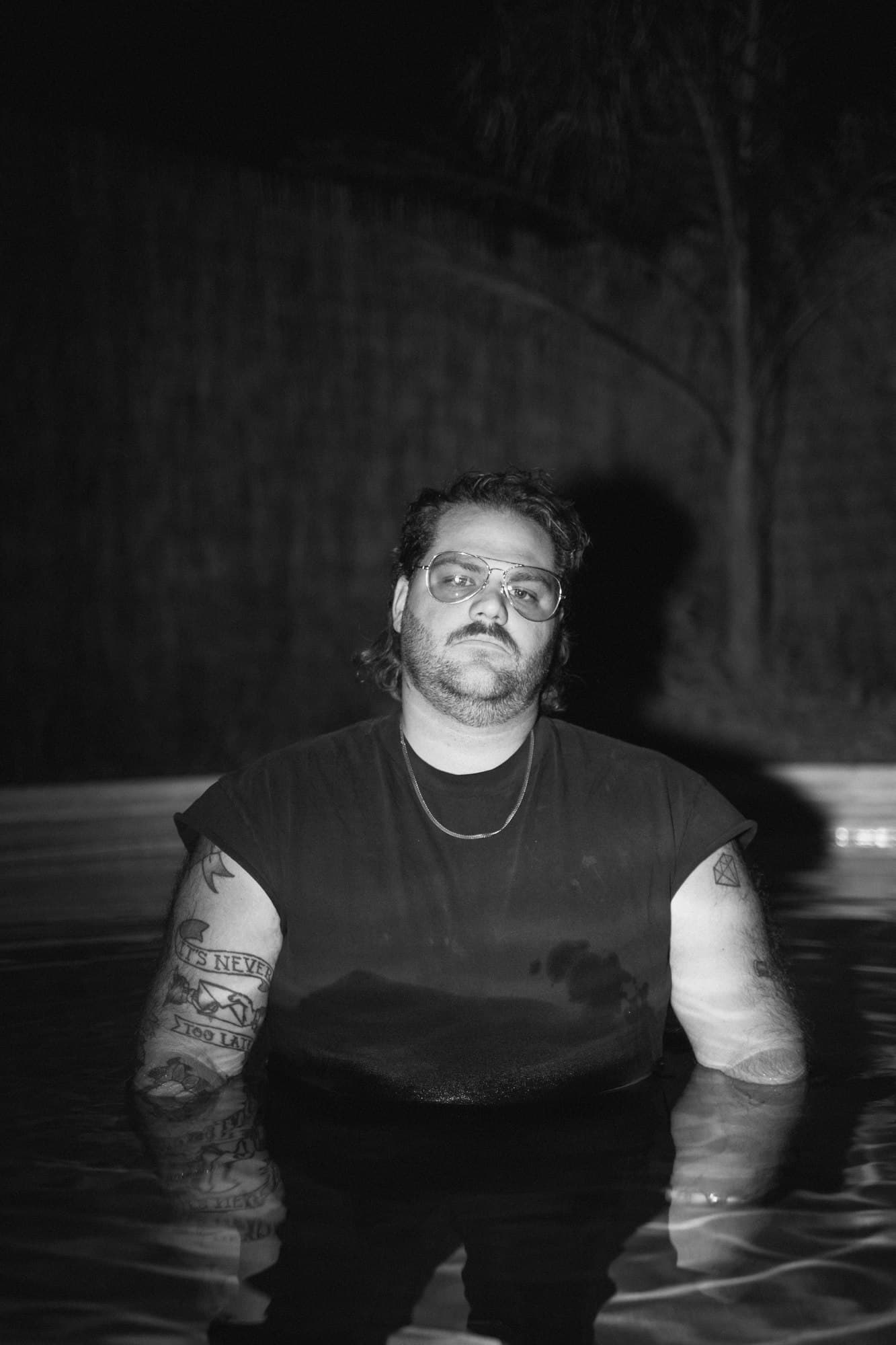 Taylor Anderson in a pool at night