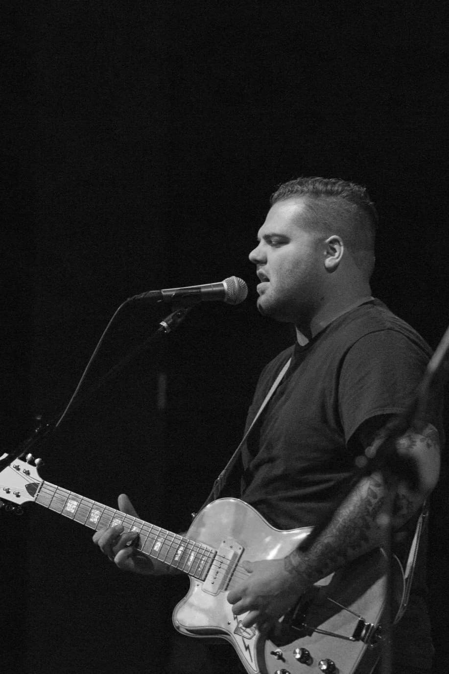 Taylor Anderson playing guitar